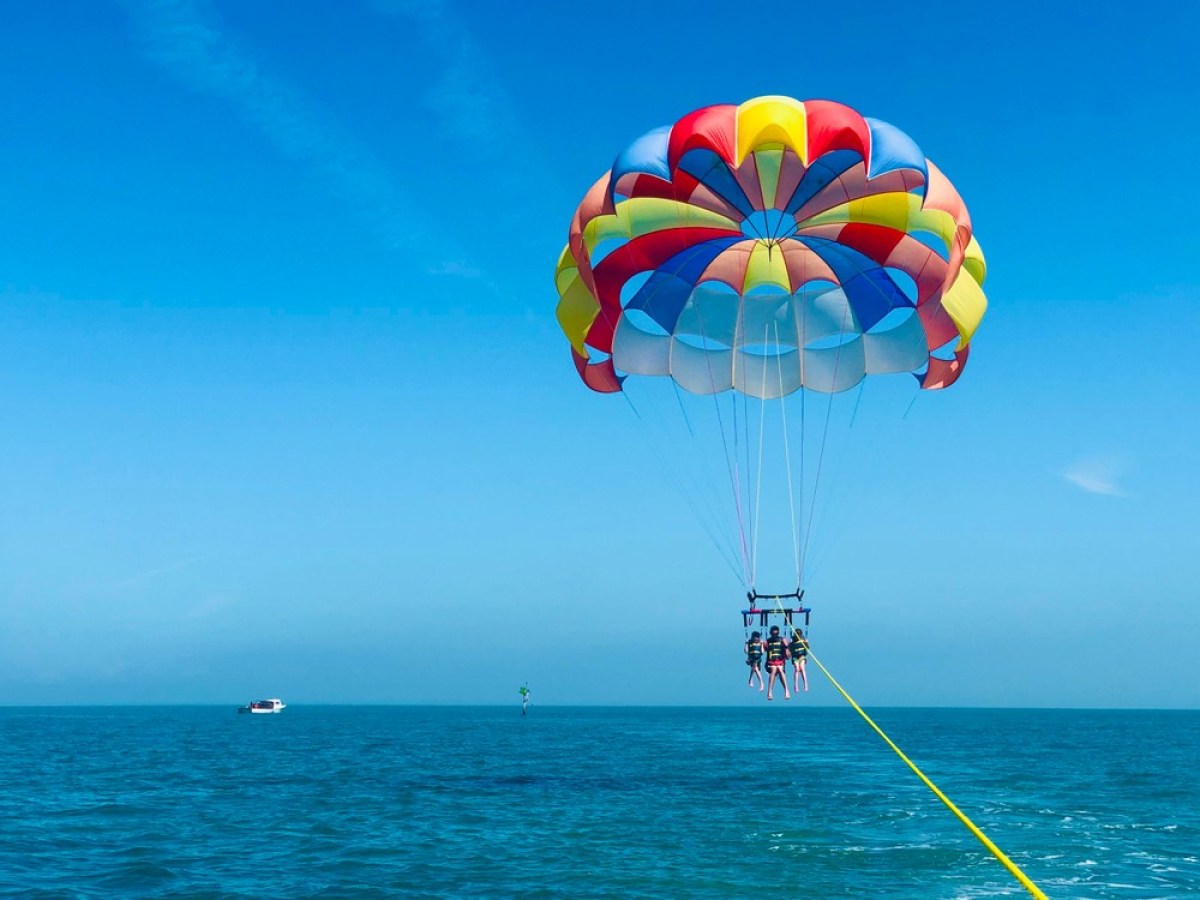 a parachute is sitting next to a body of water