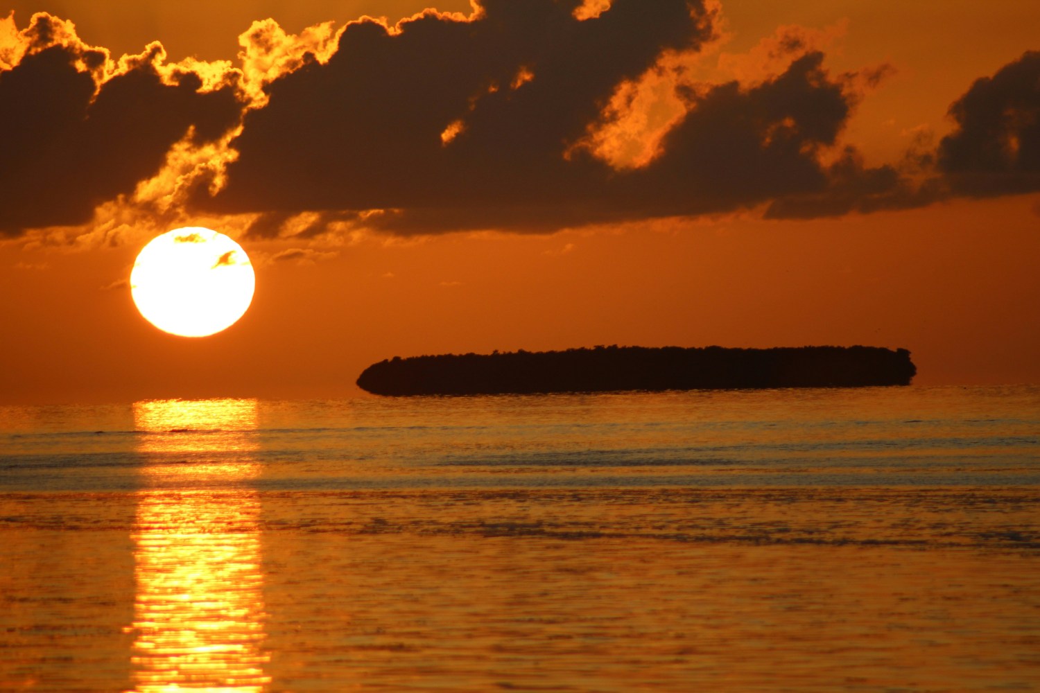 a sunset over a body of water